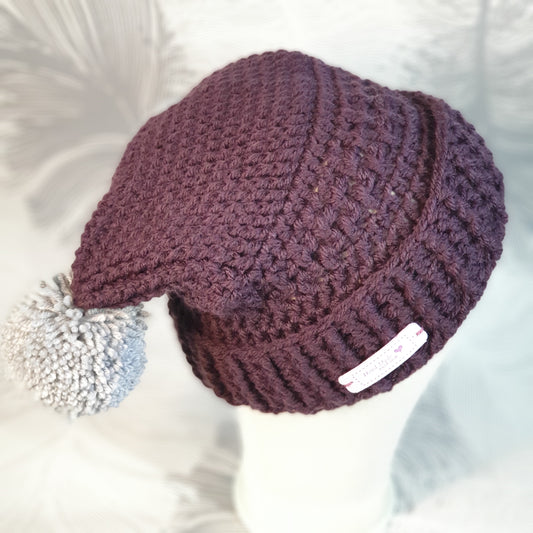 Crocheted double pompom corner hat